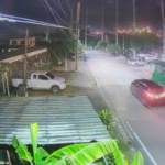 Footage from public CCTV cameras reveals that the Alphard vehicle stolen by the group of robbers (right) was driven and abandoned on the roadside near the Khlong Prapa Canal, close to a power plant in Moo 45, Ban Mai Subdistrict, Mueang Pathum Thani District on August 14, 2024... อ่านข่าวต้นฉบับได้ที่ : https://www.khaosodenglish.com/news/2024/08/16/chinese-gang-claiming-to-be-police-robs-luxury-home-in-pathum-thani/
